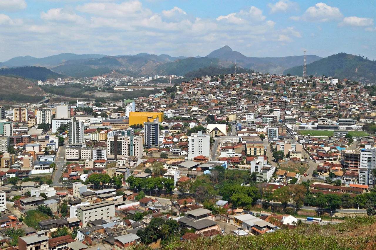 View of the downtown seen from of the high on the Santa Terezinha neighborhood, in Coronel Fabriciano, Minas Gerais, Brazil. Ana Moura peak in background.