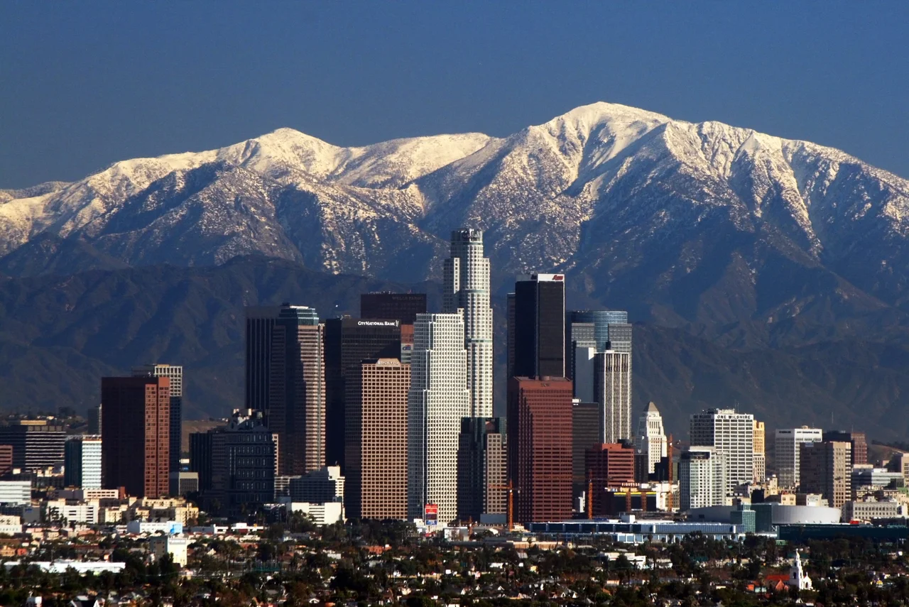 Los Angeles skyline and San Gabriel mountains.