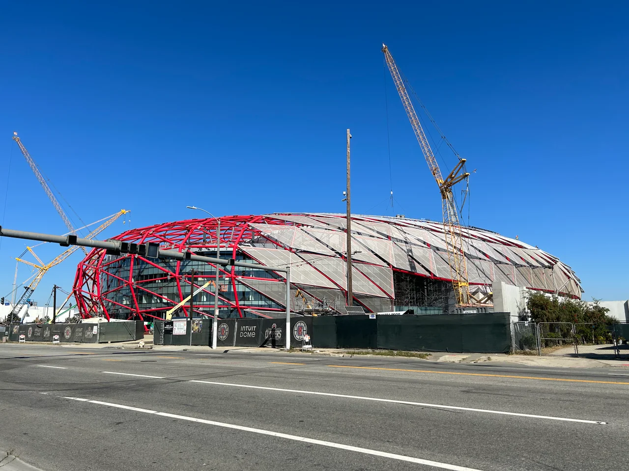 The Intuit Dome under construction from October 2023, as seen from the corner of S Prairie Ave and W 103rd St in Inglewood.