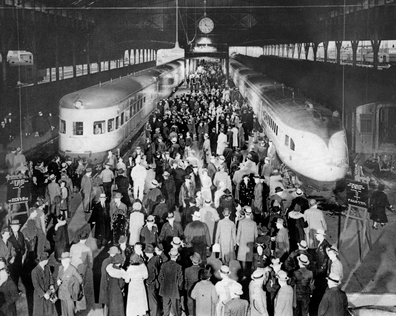 City of San Francisco  joint run of original and new train sets January 2, 1938. Original caption: ""CITY OF SAN FRANCISCO" streamliner left Oakland Pier terminal in two sections on January 2, 1938, when the new ultra-modern 17-car train was inaugurated to supplant the original 11-car train which had been in operation since June 14, 1936, for the SP-UP-C&amp;NW between San Francisco and Chicago. Both trains carried capacity loads of holiday travelers. The original streamliner was assigned to other service after this trip."