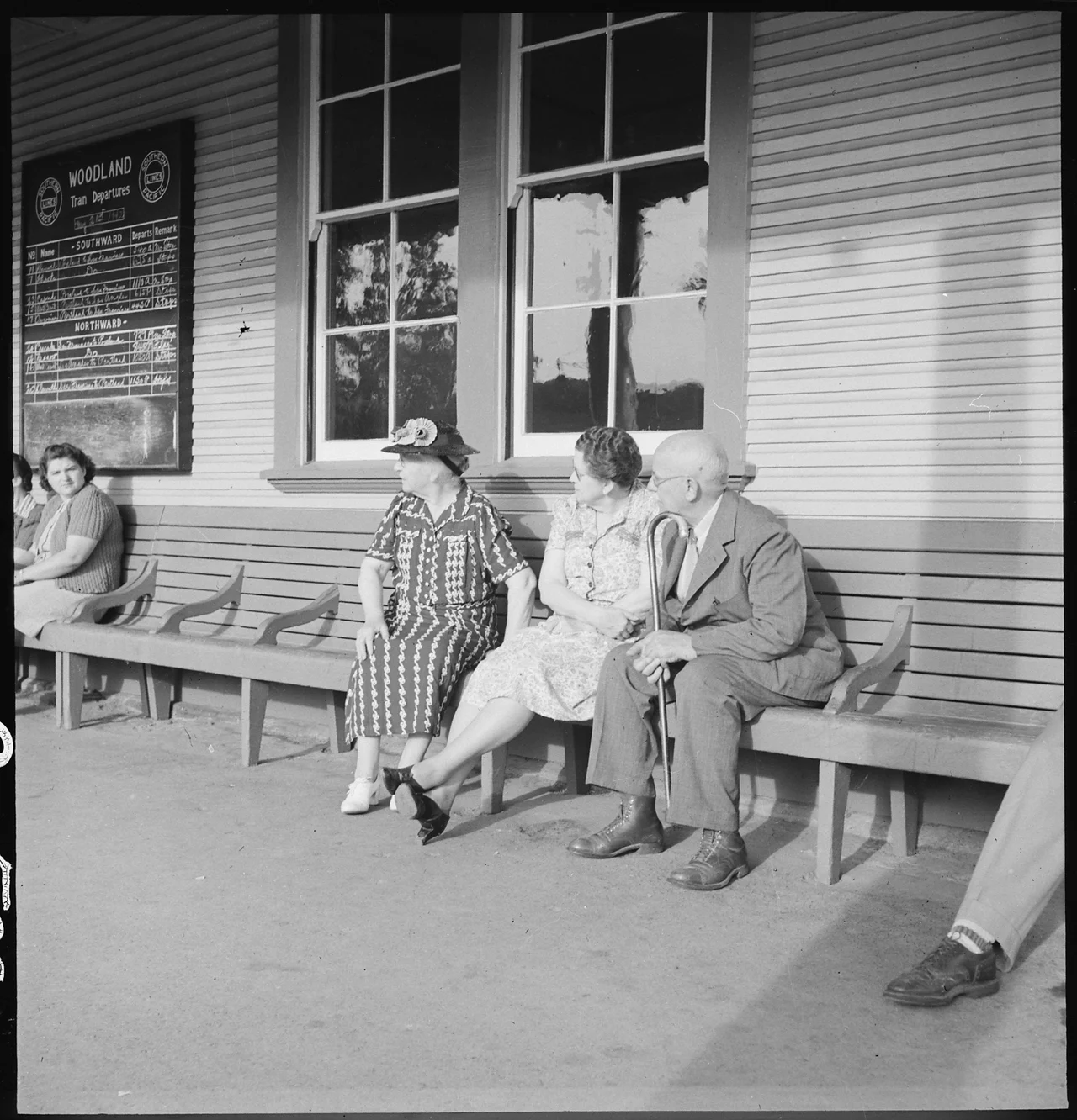 Scope and content:  The full caption for this photograph reads: Woodland, California. The departure of persons of Japanese ancestry by special train for Merced Assembly center brought many of their Caucasian friends to the station on this morning when they were being evacuated. Woodland is situated in the rich agricultural Sacramento Valley about ten miles northwest of Sacramento, California.