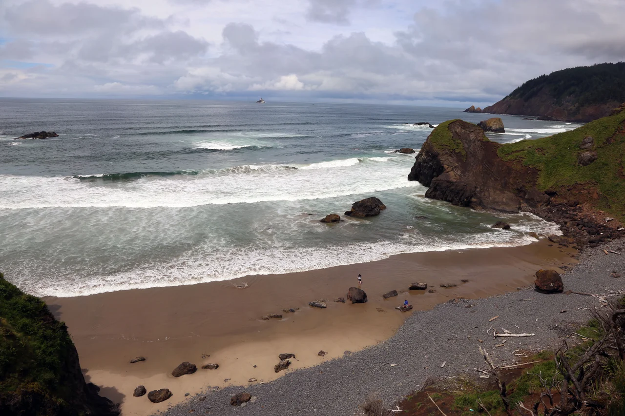 Taken from Ecola State Park, a photograph looking south along the Pacific Ocean coast toward Haystack Rock in Cannon Beach.