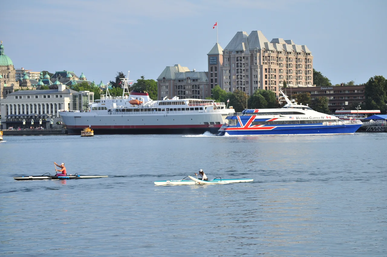 CPR Steamship Terminal, Victoria, British Columbia, Black Ball Line's M/V Coho (which does the run from Victoria to Port Angeles, Washington), and Victoria Clipper IV (which does the run to Seattle) seen from the Delta Victoria Ocean Pointe across the Inner Harbour.
