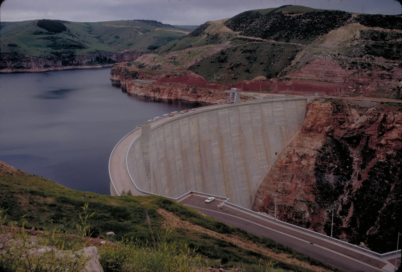Yellowtail Dam
Bighorn Canyon National Recreation Area was established by an act of Congress on October 15, 1966, following the construction of the Yellowtail Dam by the Bureau of Reclamation. This dam, named after the famous Crow chairman Robert Yellowtail, harnessed the waters of the Bighorn River and turned this variable stream into a magnificent lake. 
Bighorn Lake extends approximately 60 miles through Wyoming and Montana, 55 miles of which are held within spectacular Bighorn Canyon. The Recreation Area is composed of 70,000+ acres, which straddles the northern Wyoming and southern Montana borders. There are two visitor centers and other developed facilities in Fort Smith, Montana and near Lovell, Wyoming. The Afterbay Lake below the Yellowtail Dam is a good spot for trout fishing and wildlife viewing for ducks, geese and other animals. The Bighorn River below the Afterbay Dam is a world class trout fishing area.
Keywords: bica; Recreation areas; National parks and reserves; Canyons; Lakes