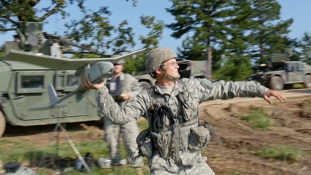 Sgt. Kevin Hall, assigned to Troop C, 1st Squadron 98th Cavalry Regiment, Mississippi Army National Guard, launches an RQ-11 Raven unmanned aerial vehicle during an Exportable Combat Training Capability exercise at Camp Shelby Joint Force Training Center, Miss., July 31, 2015. The XCTC aims to expose National Guard Soldiers to combat-training experiences needed to support Army commitments worldwide.  (Mississippi National Guard photo by Sgt. 1st Class Bill Valentine, 102nd Public Affairs Detachment/Released)