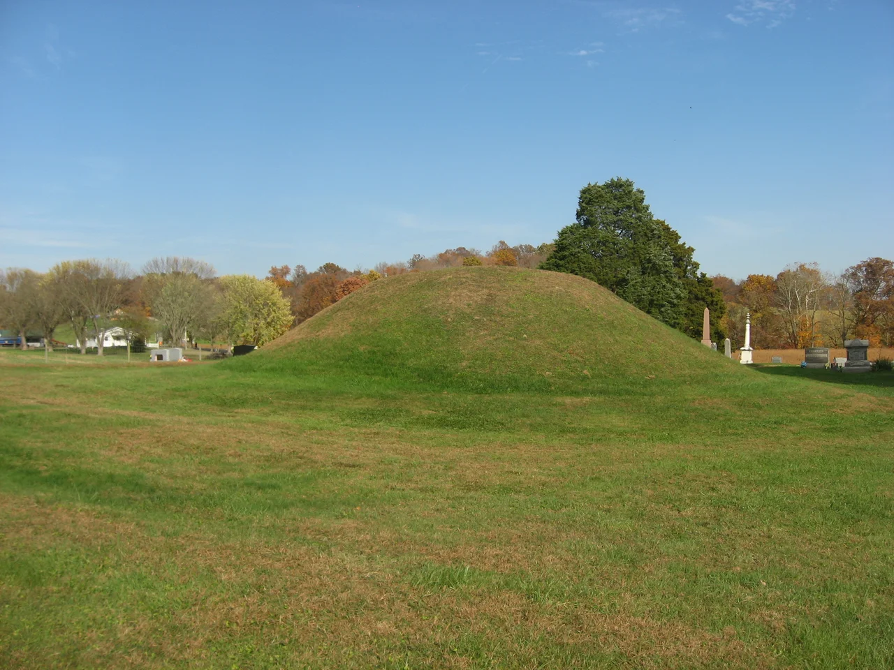 View from the west of the Mound Cemetery Mound, located in Mound Cemetery along County Road 36 north of Chester in Chester Township, Meigs County, Ohio, United States. Built by the prehistoric Adena culture, the mound is an archaeological site and is listed on the National Register of Historic Places.