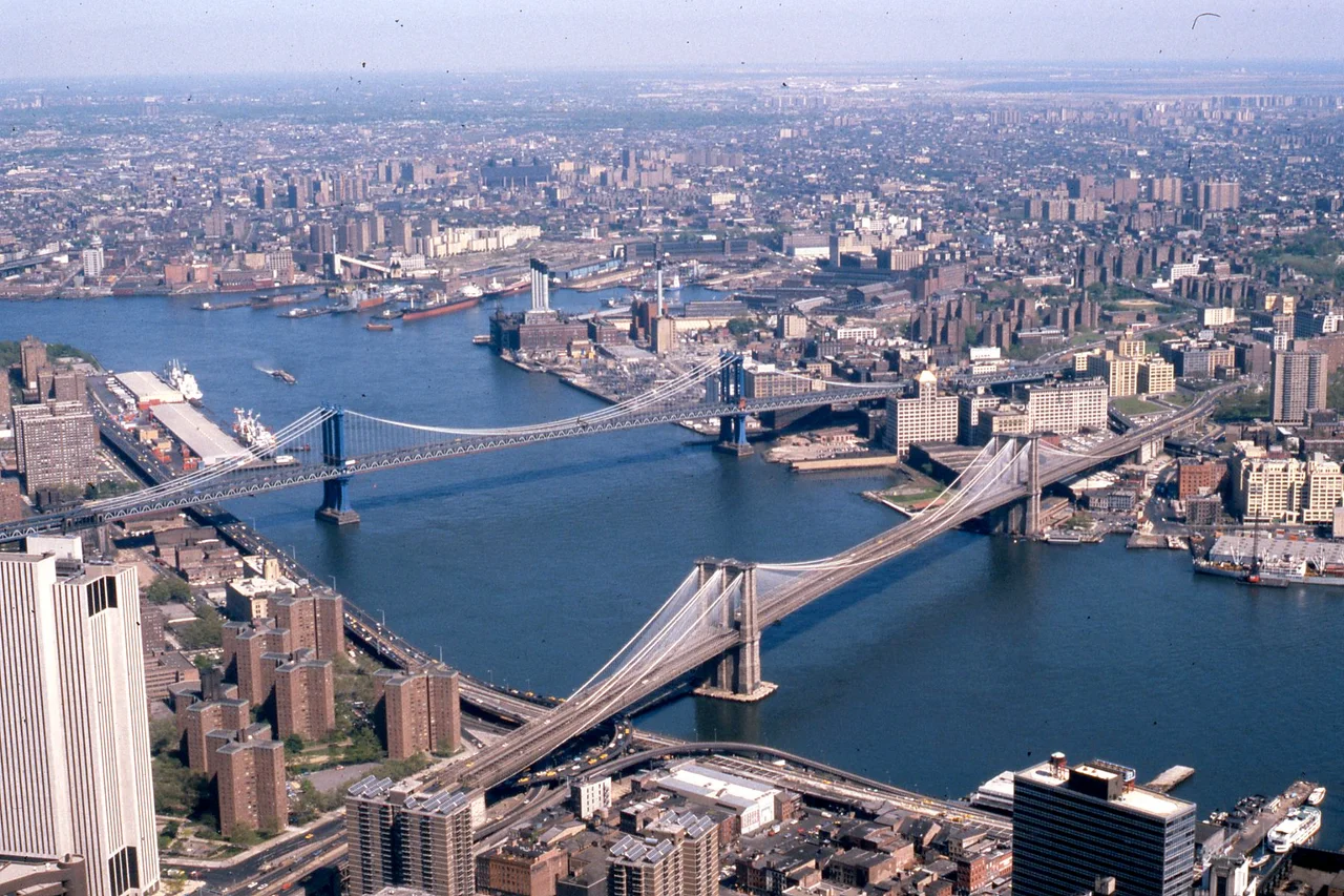 Manhattan and Brooklyn bridges on the East River, New York City, with Queens and Manhattan at top and bottom, 1981. For Bridges and tunnels in New York City.
Other information
Photo by George Garrigues.