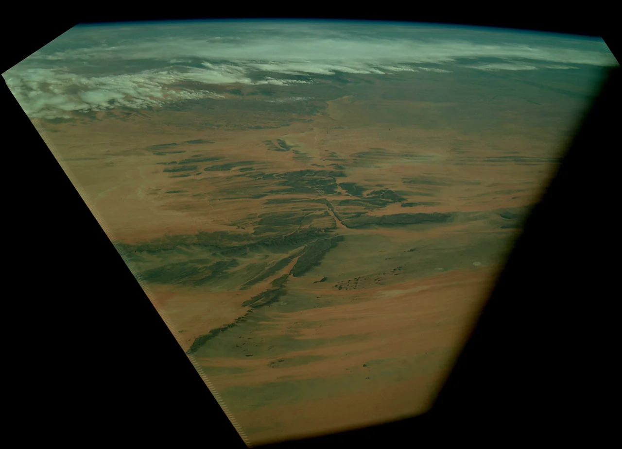 Dhar Adrar Mountains of Mauritania, viewed by Apollo 9 from orbit.  Rotated and cropped, then brightness and contrast adjusted from original.