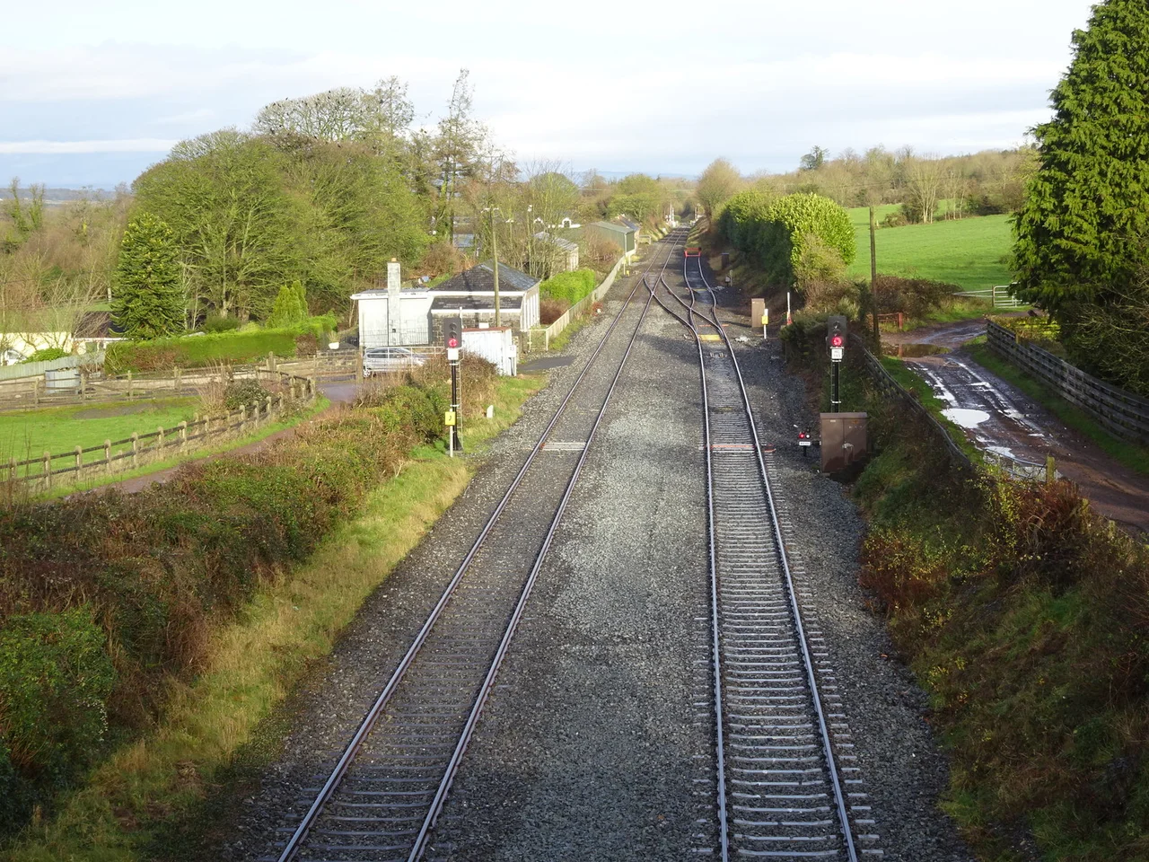 Ballyhale railway station (site), County KilkennyOpened in 1853 by the Waterford & Kilkenny Railway on the line between those two places, it later became part of the Great Southern & Western Railway. This station closed in 1963.
View north towards Thomastown & Kilkenny. The building was still extant when this image was taken but the platform had been removed.