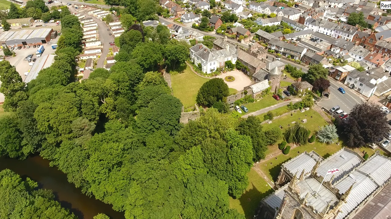 Tiverton Castle in Devon, England, aerial photograph with River Exe and St Peter's parish church. Looking towards north-east.