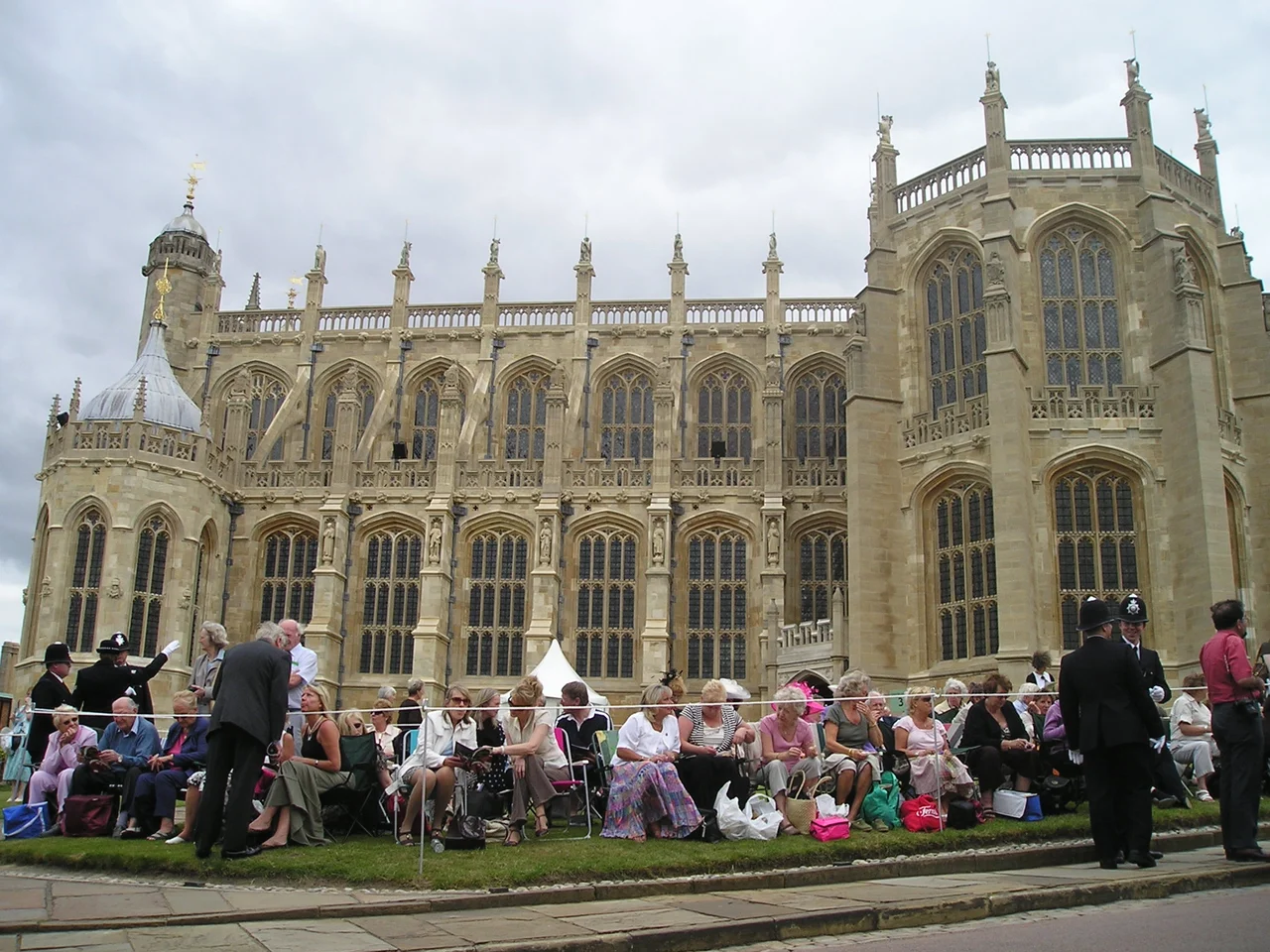 Members of the public waiting outside St George's Chapel at Windsor Castle to watch the procession to the service of the Order of the Garter.