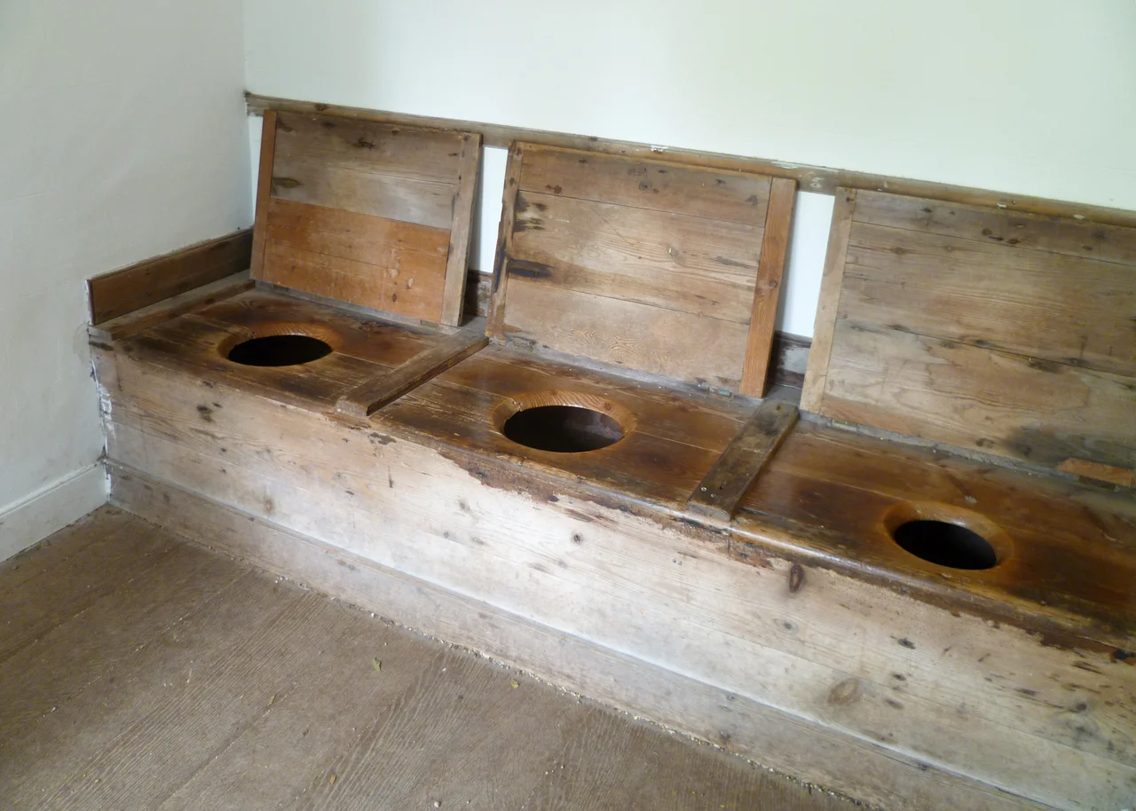 Inside the early 18th century privy from Townsend House, Leominster, showing the 3-seat earth closet. Preserved in the Avoncroft Museum of Historic Buildings, Worcestershire.