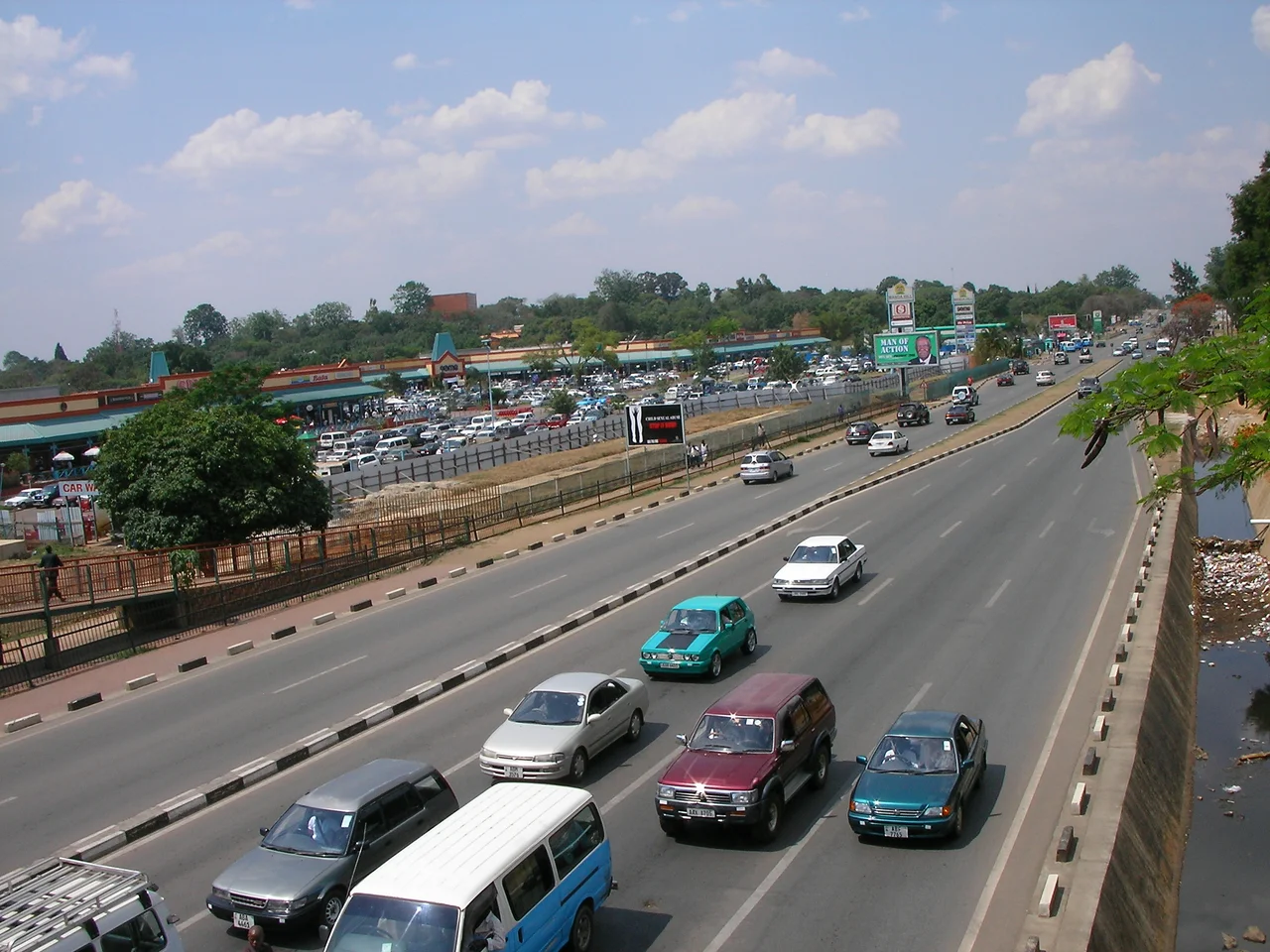 Looking northeast over the Great East Road in Lusaka, Zambia towards Manda Hill Shopping Centre.  Photo is taken from pedestrian overpass at intersection of Great East Rd and Addis Ababa Drive.