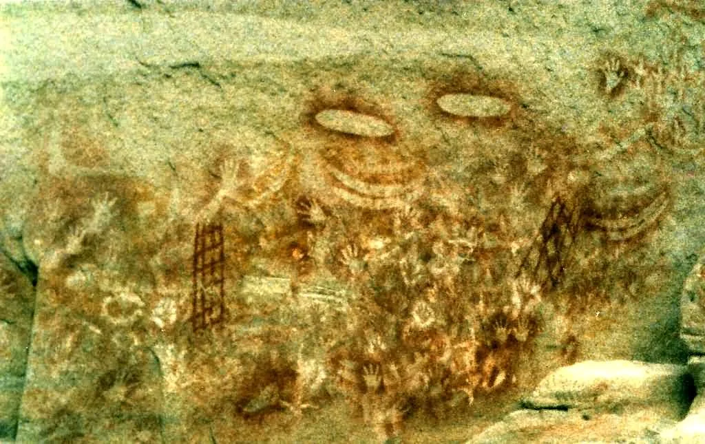 Stencil art showing unique clan markers and dreamtime stories symbolising attempts to catch the deceased's spirit. Photo taken September 1985.
