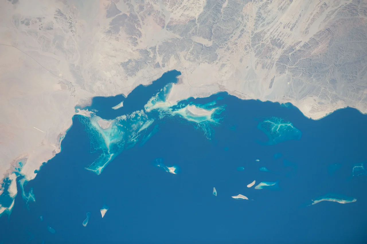 View of Earth taken during ISS Expedition 31. Neom coast, Saudi Arabia, Red Sea, islands Jazirat Rayaman, Burqan, ybw', Wahli, wadis.