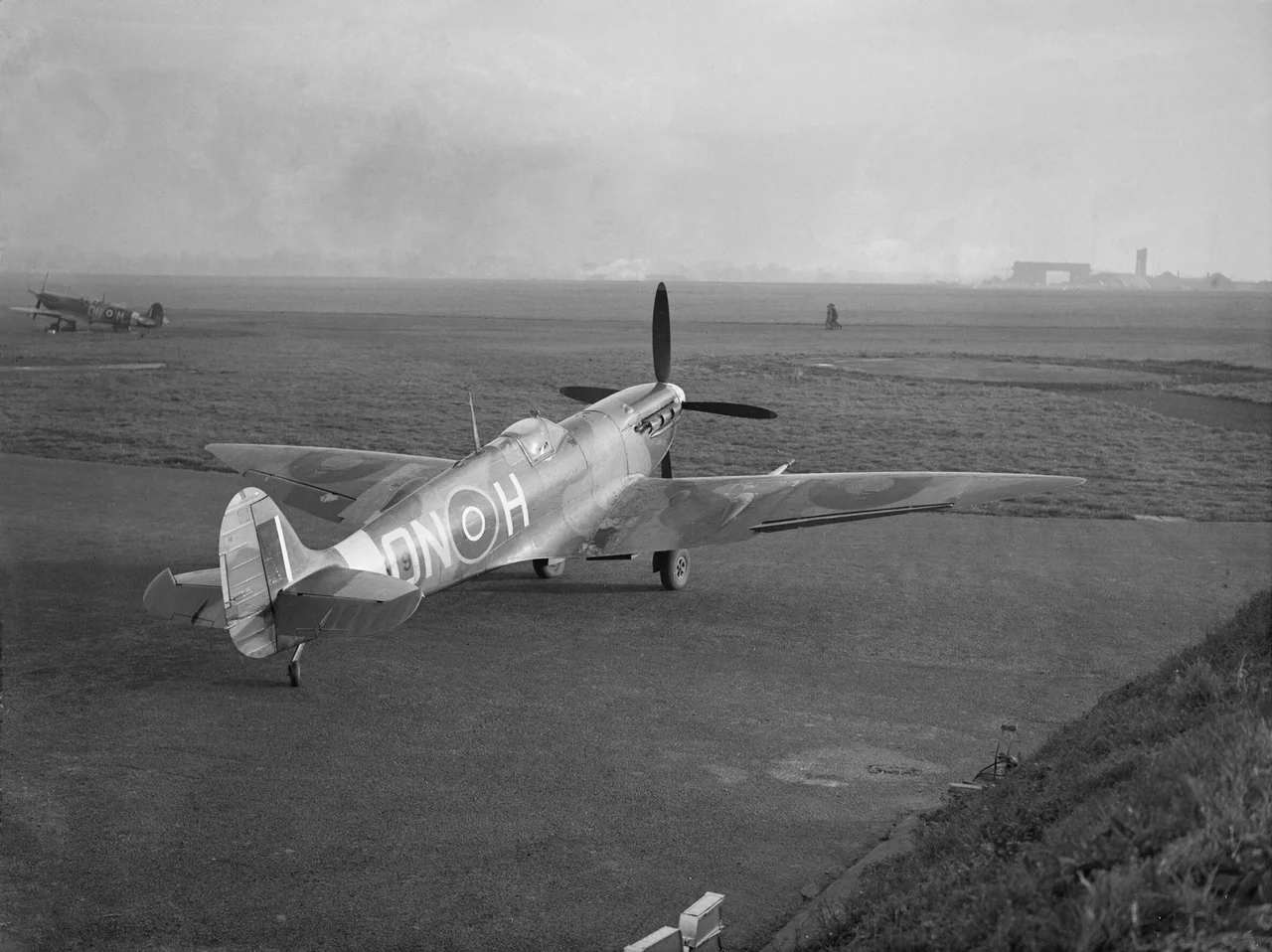 A Supermarine Spitfire Mark VI, BR579 'ON-H', of No. 124 Squadron RAF, parked in a dispersal at North Weald, Essex (UK).