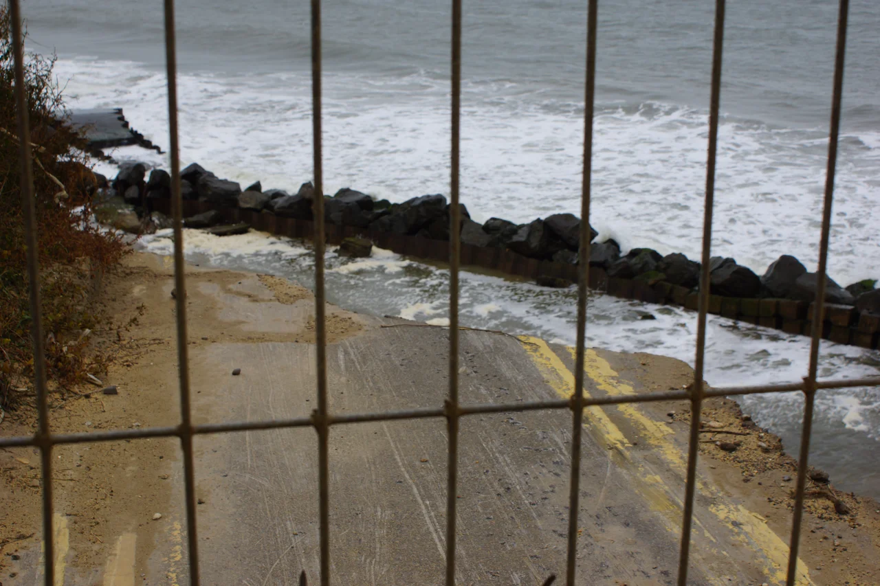 Road in Happisburgh, Norfolk, UK, washed out due to severe coastal erosion on the North Norfolk coast.