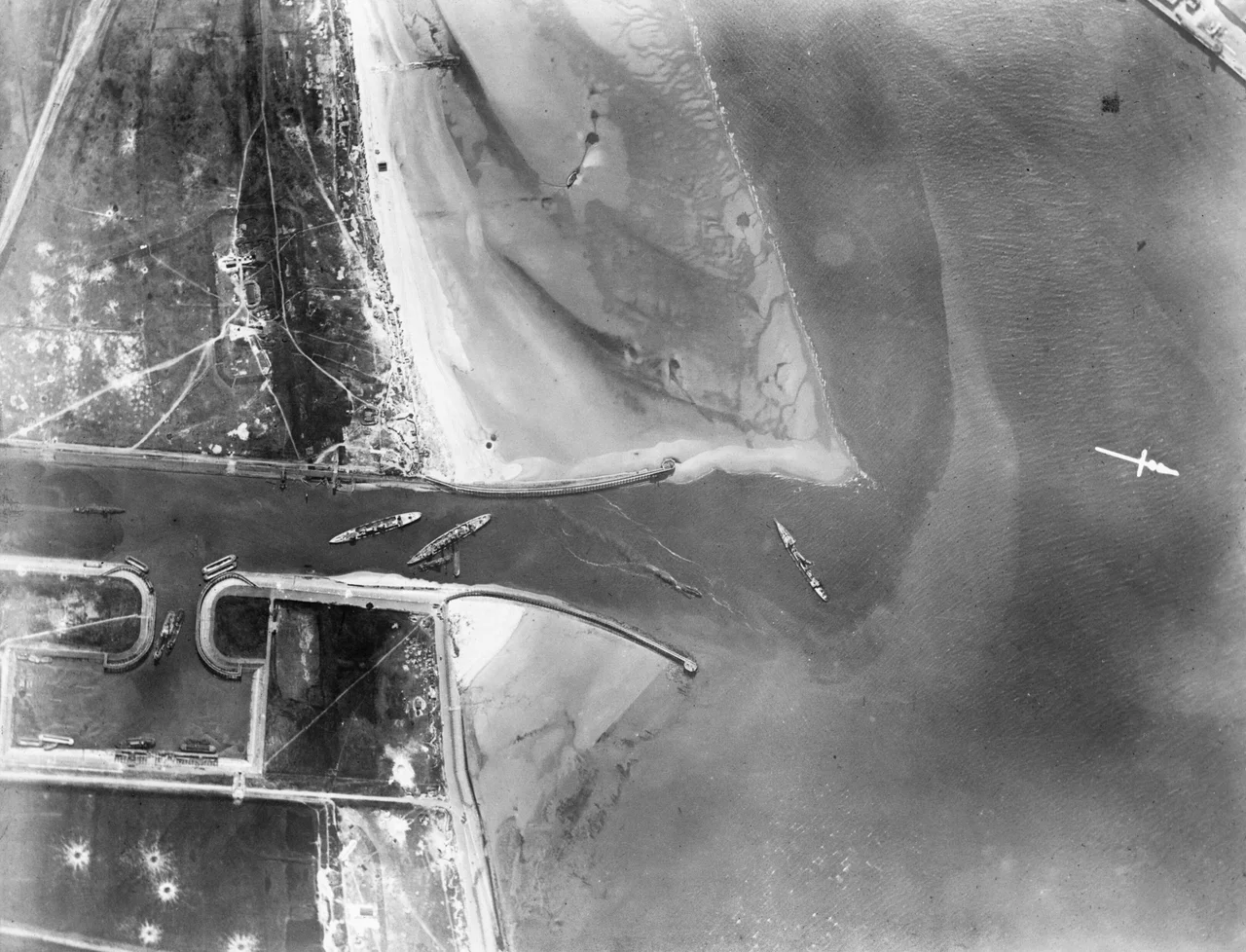 Aerial photograph showing aftermath of the Zeebrugge Raid. British blockships, from left to right: HMS Intrepid, HMS Iphigenia, HMS Thetis.