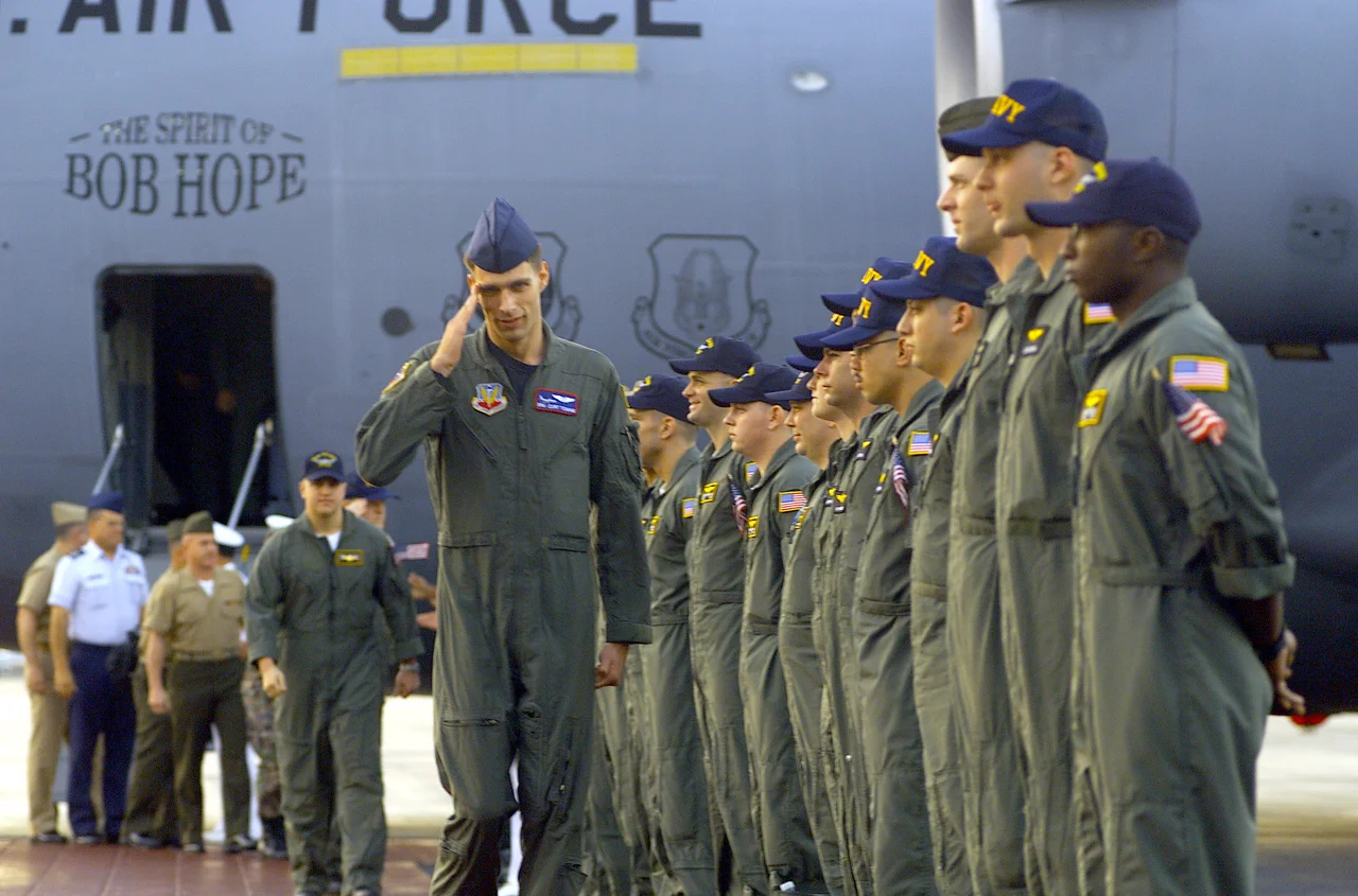 Air Force Senior Airman Curtis Towne salutes as he returns home from Hainan on April 12, 2001. He was a crewmember on the U.S. Navy EP-3 aircraft that was involved in an accident with a Chinese F-8 aircraft on April 1, 2001.