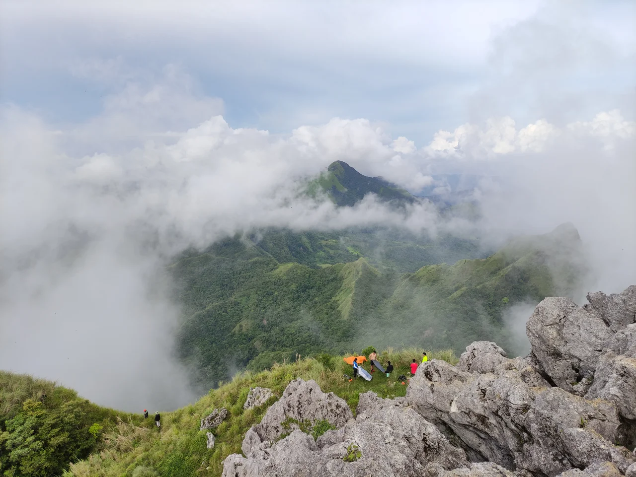 Scenic mountain view at the summit of Iloilo Pride mountain "Mt. Napulak".
Mt. Napulak is one of Igbaras’ most sought after tourist attractions. Standing 1,239 meters tall, the mountain surely is a challenge to climb but the challenge is all worth it as soon as you realize that the journey is just as beautiful as the destination.

Mt. Napulak. Meaning “nipple” in the local language because of the rounded rock that sits at its very summit, this mountain is the most popular hiking destination in Panay, given its easy access from the university town of Miag-ao and the major commercial centre in the region, Iloilo City, where many local mountaineers are based.