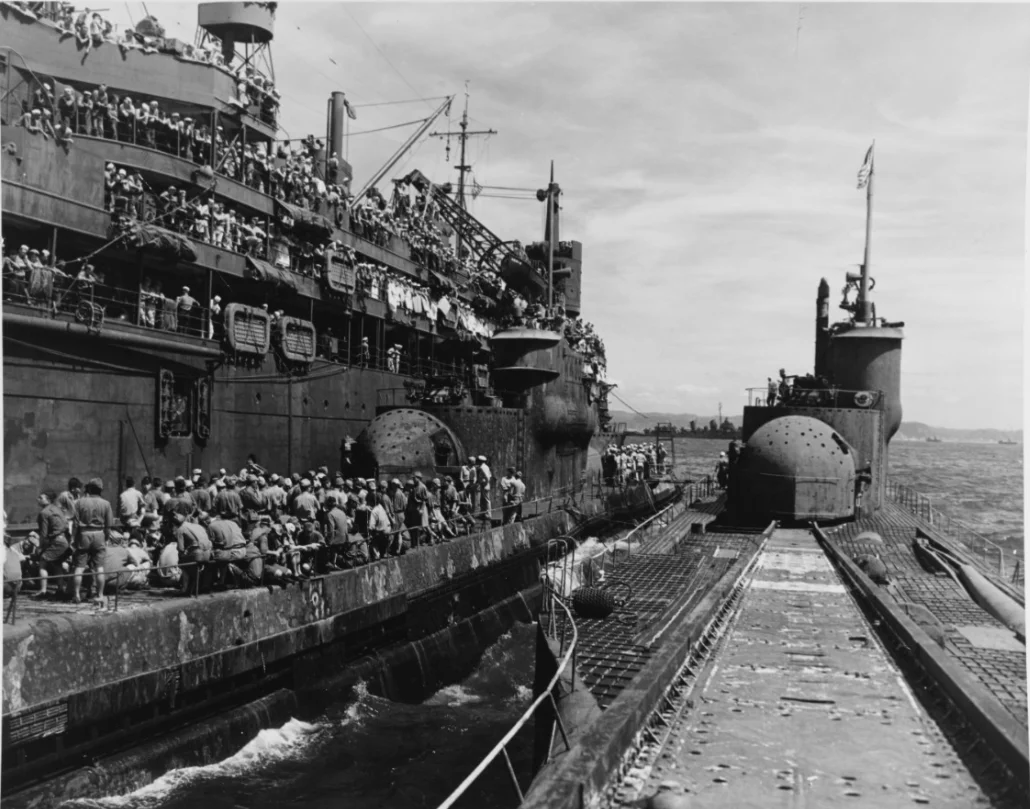 The United States Navy submarine tender USS Proteus (AS-19) (left) and Imperial Japanese Navy submarines Japanese submarine I-14  2 (center) and Japanese submarine I-400  2 (right) in port in Japan after the end of World War II.